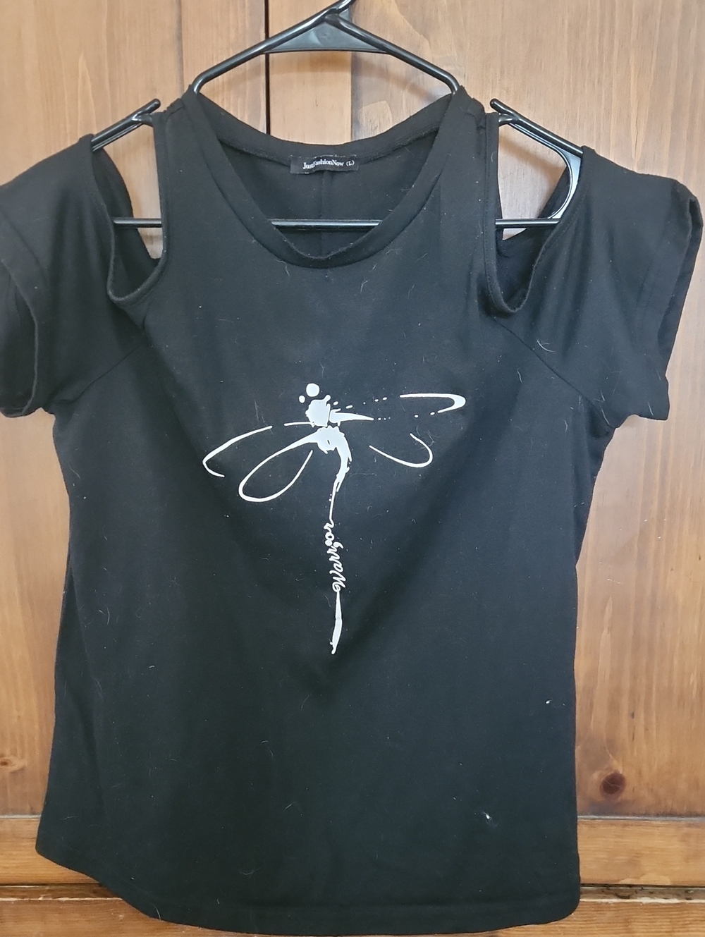Just Fashion Now Black Off-Shoulder Tee with White Dragonfly "Warrior" Print